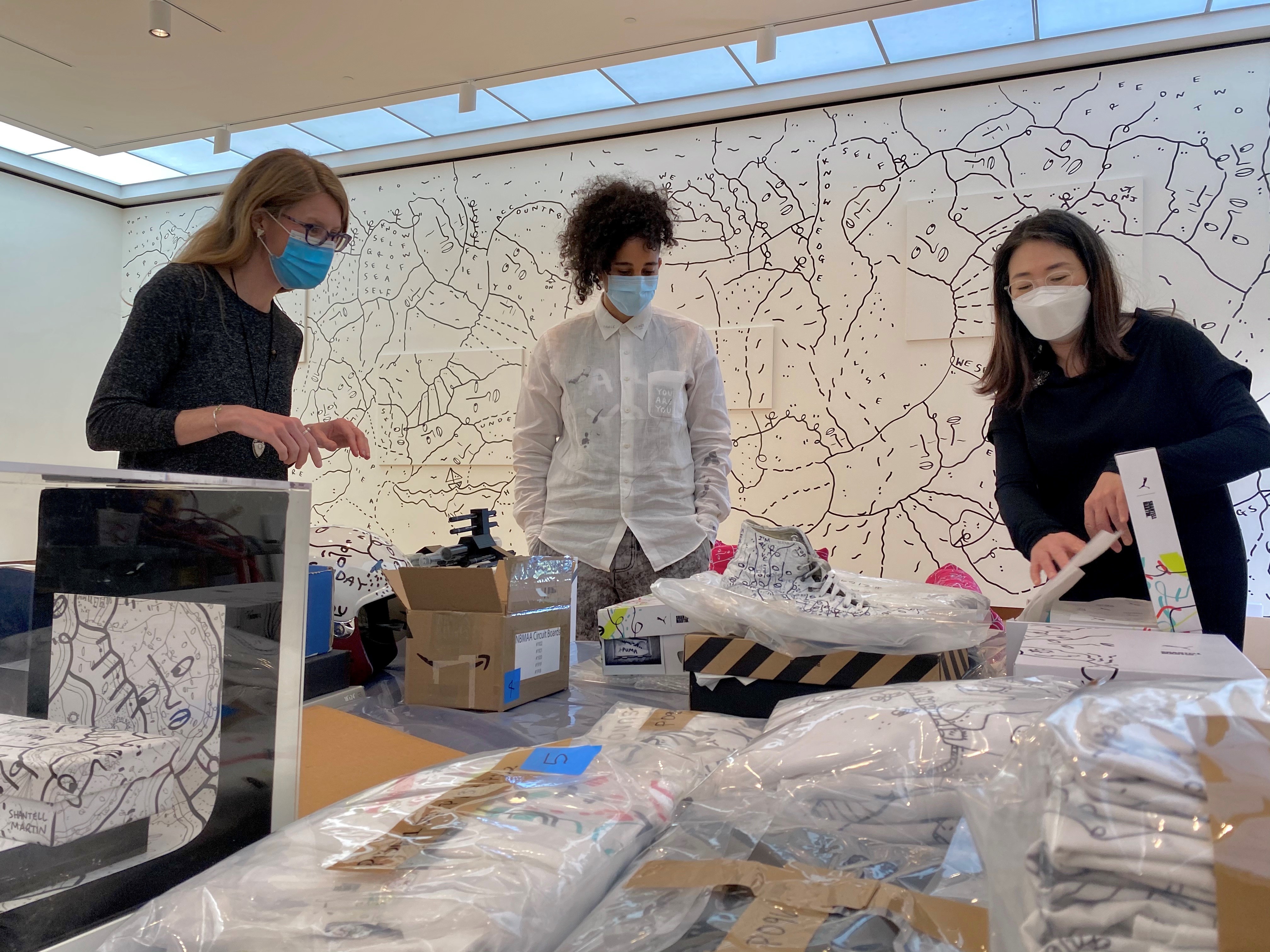 Pictured: Lisa Williams (left), during the install of <i>NEW/NOW: Shantell Martin </i>
