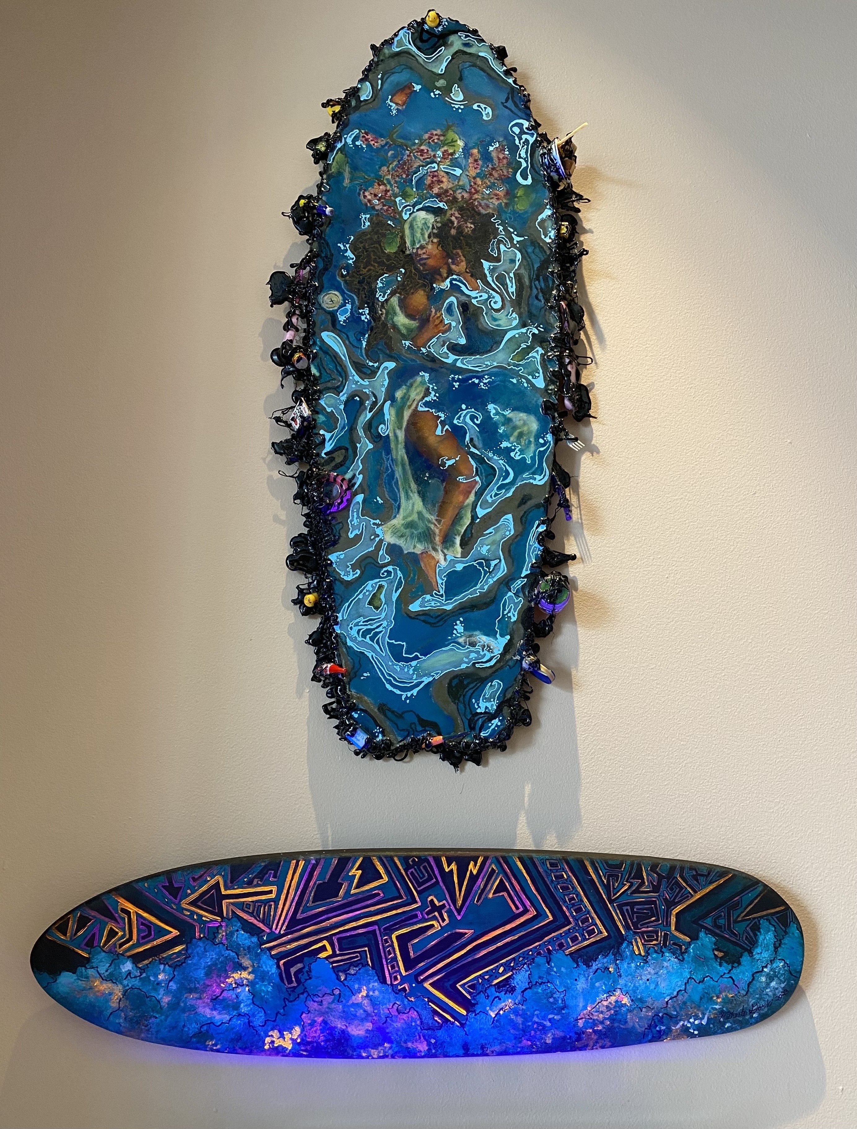 (Above) Tamhja Elizabeth Coe, "Being Submerged," 2023, Mixed media: pastels, wood resin, marker; (Below) Michaela Gorski, "A Skateboarder's Guide to the Galaxy," 2023, Acrylic paint on wood