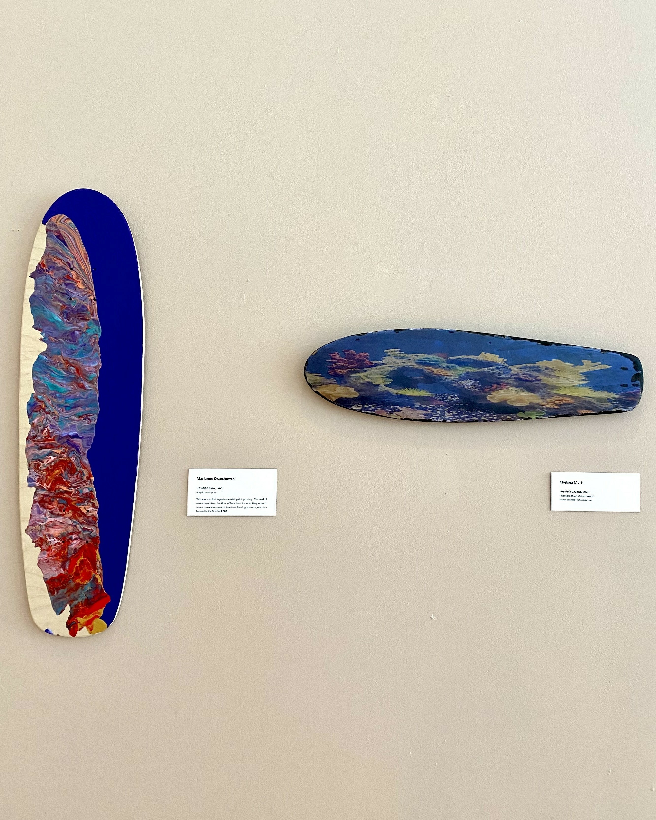 (Left) Marianne Orzechowski, "Obsidian Flow," 2023, Acrylic paint pour; (Right) Chelsea Marti, "Ursula's Cavern," 2023, Photograph on stained wood